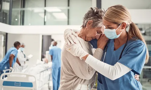 Doctor comforting patient
